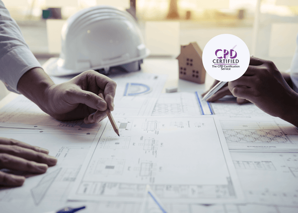 Two construction site administrators review building plans with pencils, while a hard hat and model house sit in the background, symbolising CDM awareness in practice.