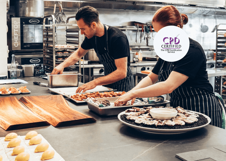 Chefs working in a professional kitchen, preparing food as part of CPD-certified Level 1 Food Safety training in a catering environment.