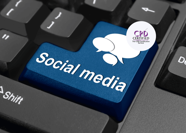 Close-up of a keyboard with a blue key labelled "Social media," displaying white speech bubble icons.