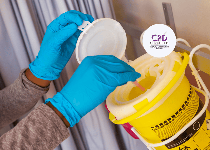 Gloved hands carefully place a used medical syringe into a yellow clinical sharps bin, demonstrating safe disposal practices to prevent sharps injuries.