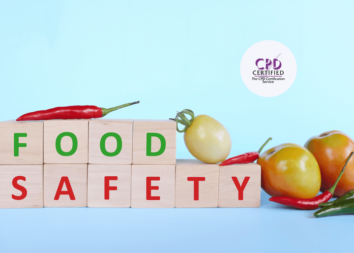 Wooden blocks spelling “FOOD SAFETY” surrounded by fresh red chillies and tomatoes on a light blue background, representing safe food handling practices.