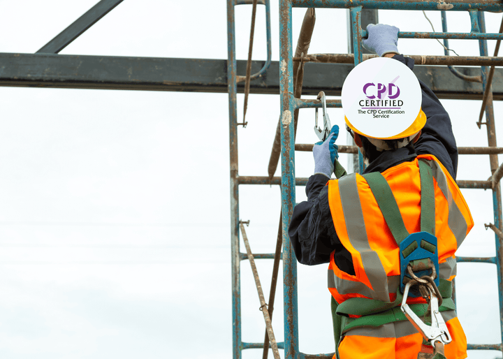 A worker in a hi-vis vest and safety harness climbs scaffolding while securing fall protection equipment, demonstrating safe practices for working at height.