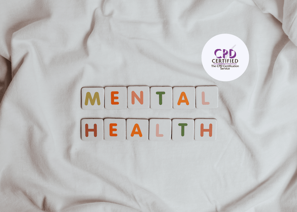 Letter tiles forming the words “Mental Health,” neatly arranged in two rows on a white fabric background.