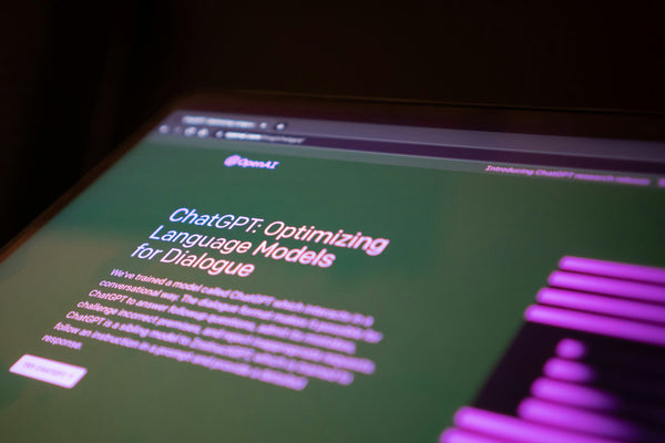 ChatGPT webpage on a computer screen with the title "Optimizing Language Models for Dialogue".