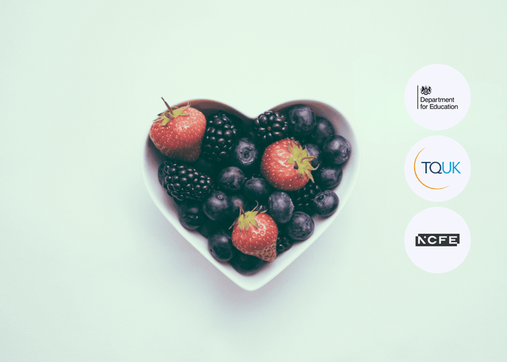 Heart-shaped bowl filled with fresh strawberries, blueberries, and blackberries on a light background, symbolising healthy eating and allergy awareness.