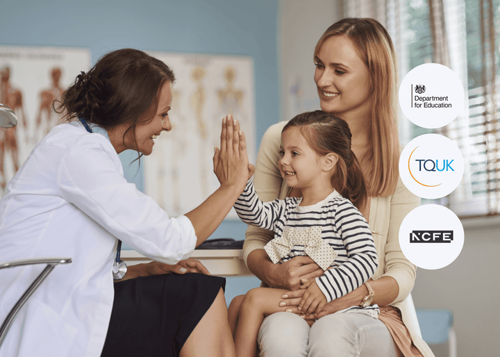 A smiling doctor gives a high five to a young girl sitting on her mother’s lap in a bright medical consultation room, creating a warm and supportive atmosphere.