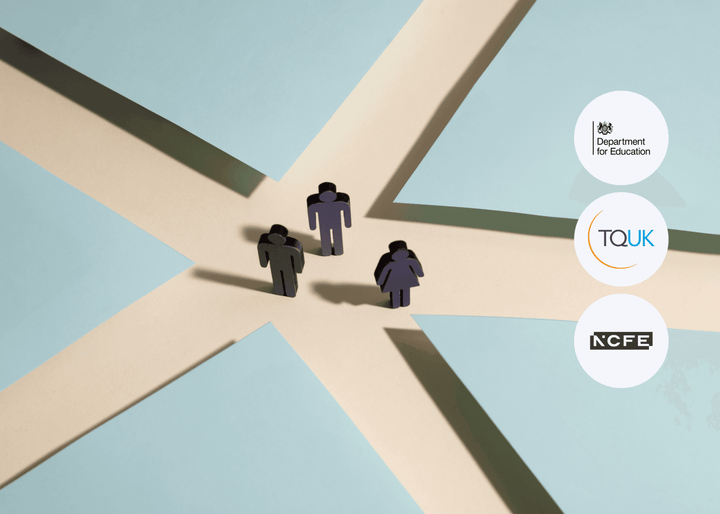 Three silhouetted human cut-outs stand at intersecting beige paths between blue paper blocks, suggesting a crossroads or decision point