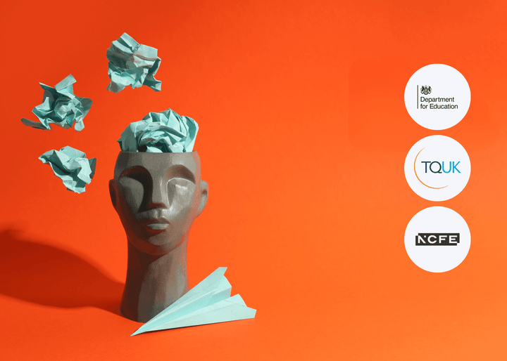 A grey sculpted head with blue crumpled paper emerging from the top is set against a bright orange background, symbolising dementia, memory, or mental health.