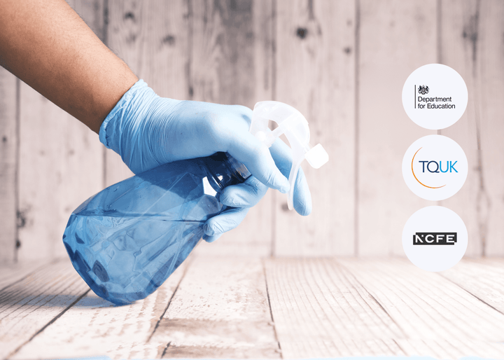 A gloved hand holding a blue plastic spray bottle above a wooden surface, set against a light wooden wall with soft lighting, symbolising safe handling of substances.