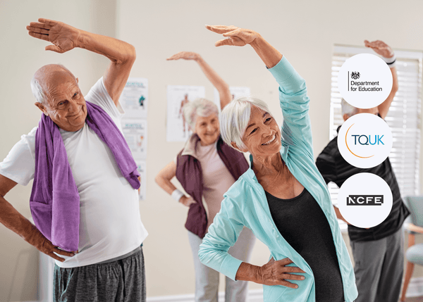 A group of older adults in activewear smiling while performing side stretches together in a bright room as part of a guided exercise routine.